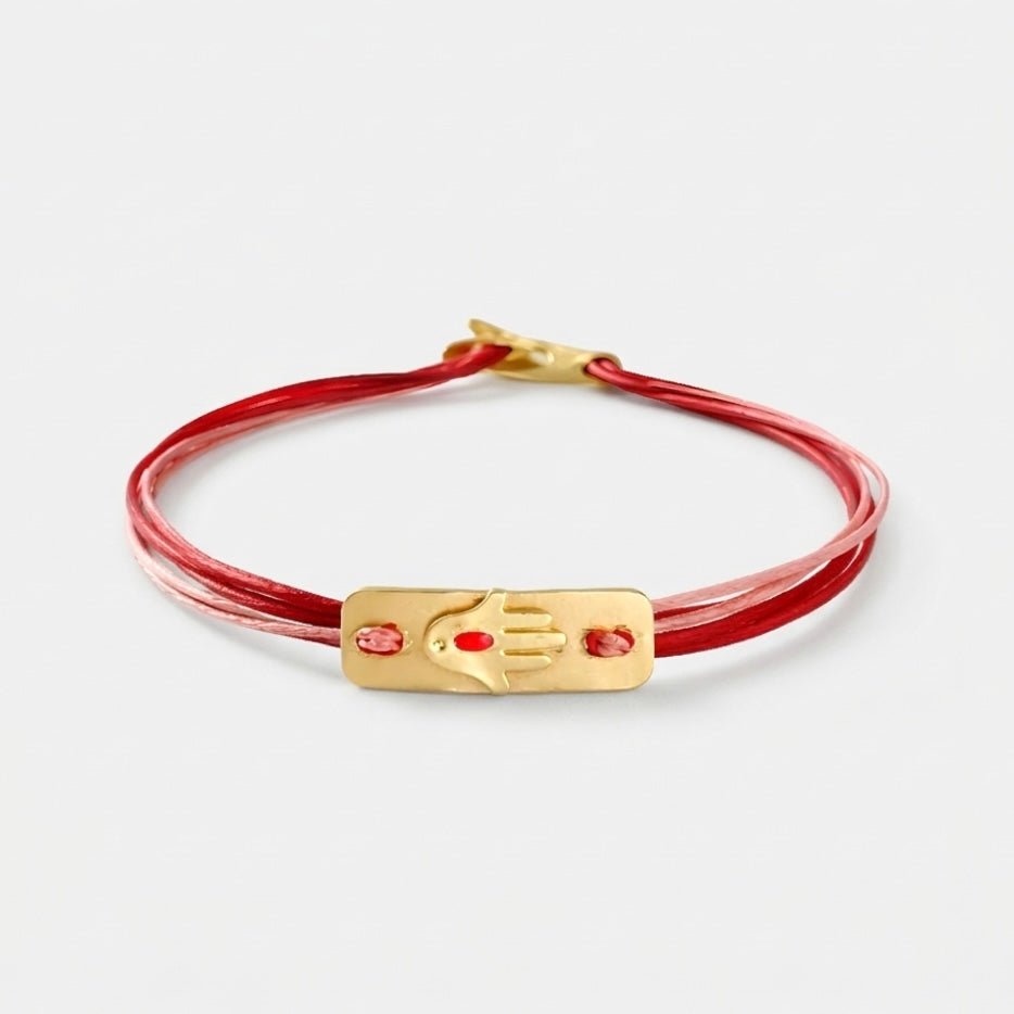 14K Gold Hamsa Bracelet featuring a hand-sawn solid 14K gold plate and bench-made clasp.