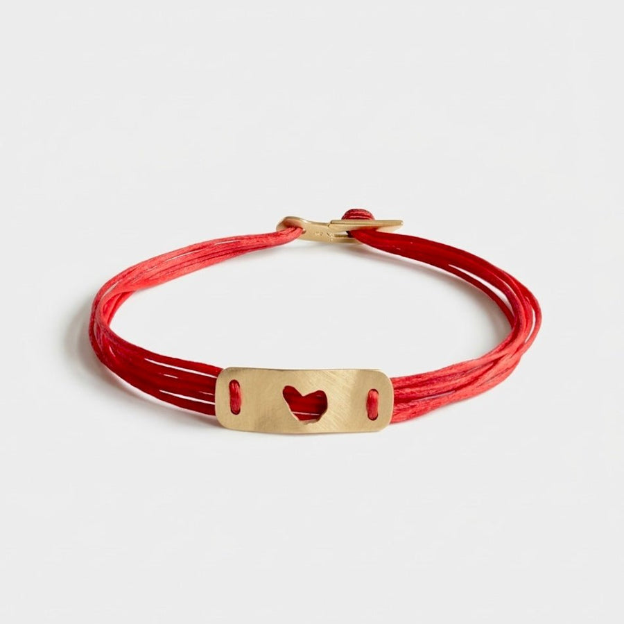 14K Gold Heart Bracelet featuring a solid 14K gold heart plate and bench-made clasp.