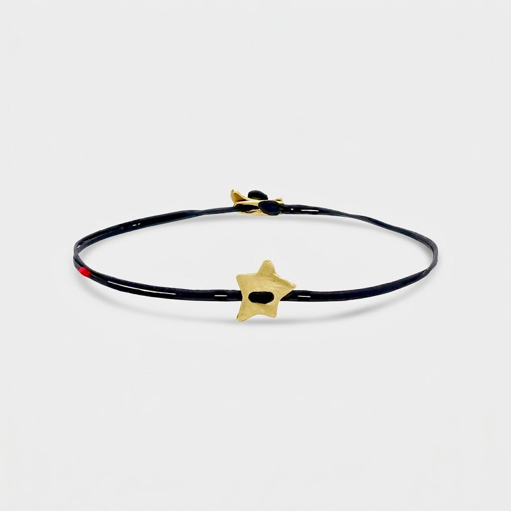 14K Gold Star Bracelet featuring a solid 14K gold charm and bench-made clasp.